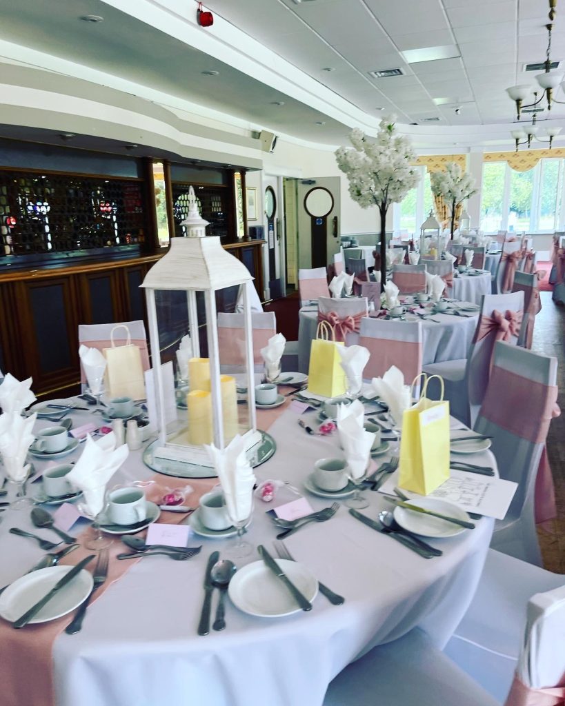 Hurricane candle lantern as wedding table centrepiece